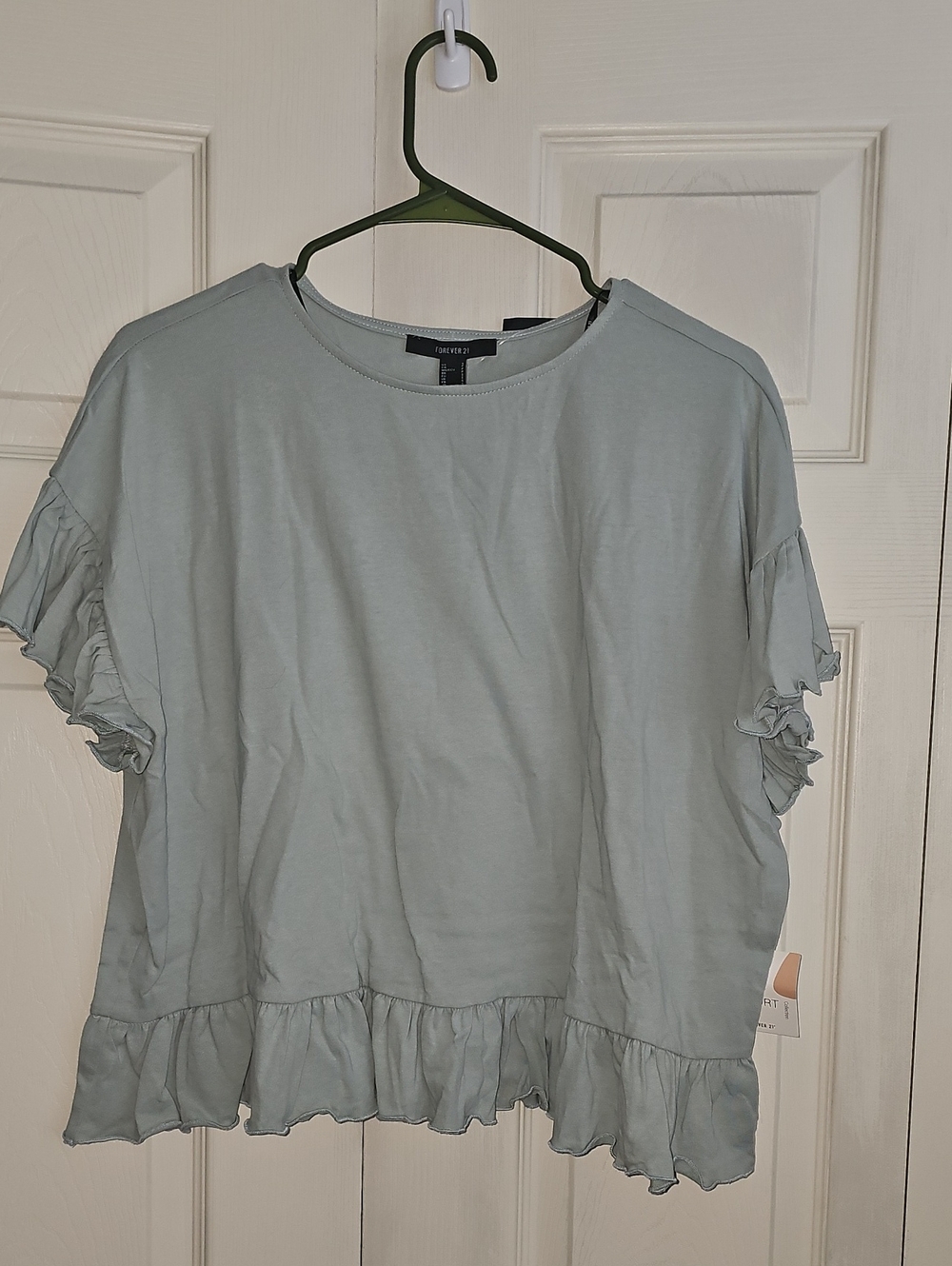 Forever 21 seafoam Ruffle Hem Short Sleeve Top NWT. cont H
